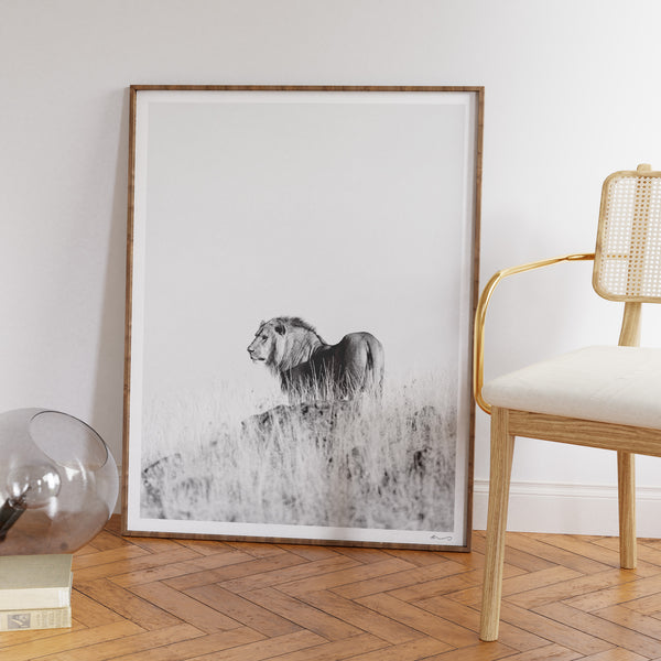 Framed "Pride Rock" print leaning against wall in modern setting
